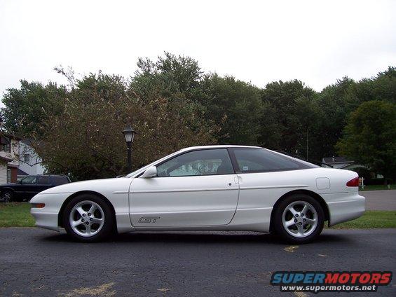 White 1993 Ford Probe GT coupe, side view, parked on asphalt driveway