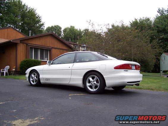White 1993 Ford Probe GT parked in driveway, side view