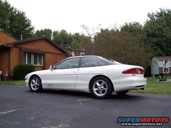 White 1993 Ford Probe GT coupe parked on asphalt driveway, side view