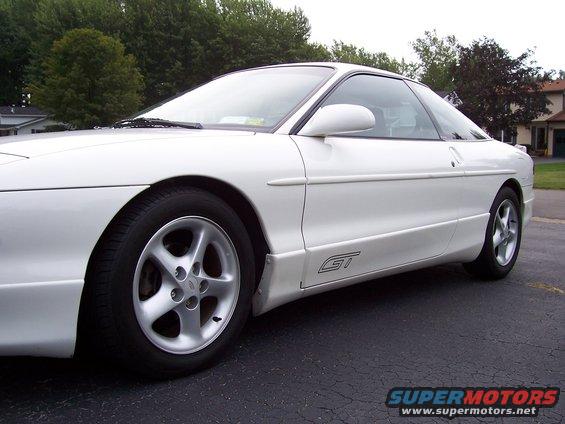 White coupe side view with GT badging