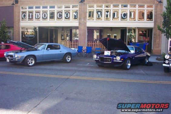 Blue 1970 Chevrolet Camaro parked on street, hood up
