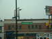1978 Ford Mustang II - A street sign for Woodward Ave is visible above a brick building with a blue sign for Gracie's.