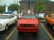 1978 Ford Mustang II - Red 1978 Ford Mustang II at a car show with other vehicles present.