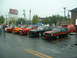 1978 Ford Mustang II - A line of classic Ford Mustang IIs are displayed at an outdoor car show on a cloudy day.