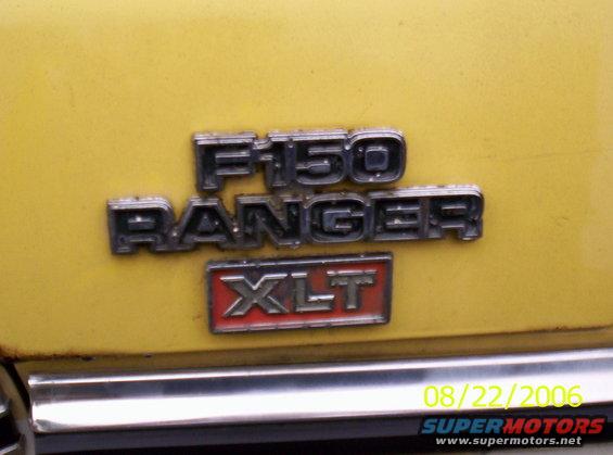 Close-up of F-150 Ranger XLT emblem on yellow vehicle. Date stamp 08/22/2006