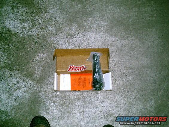 Rough Country steering stabilizer in an open box with instructions