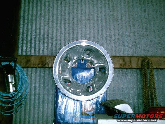 Silver hubcap with five lug nut holes