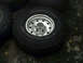 1996 Ford Bronco - BFGoodrich Mud-Terrain T/A tire and chrome wheel shown up close.