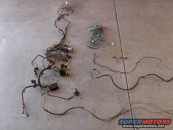 There's the old factory Ford Fairlane wiring harness. With it out, it doesn't look like there's much to it. By the way, that bundle with green wires and little black box were for the aftermarket stereo and tachometer, not factory. 