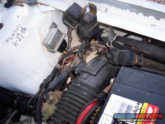 1990 Dodge Shadow engine compartment wiring with handwritten 'NEW BATT 6-27-06' on white surface