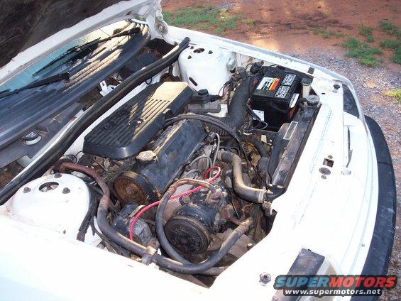 1990 Dodge Shadow engine bay with engine, battery, and radiator visible