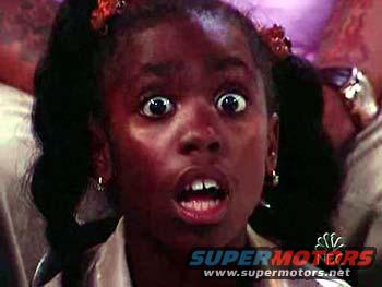 Young girl with a shocked expression, pigtails, and hoop earrings. Text at bottom says SUPERMOTORS