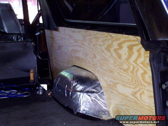 100_0773.jpg custom wood rear panel
that flappy old plastic just wansn't cutting it