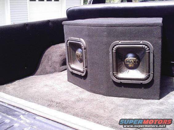 imag0004.jpg $100, 2- 800w lanzar subs mounted in custom box w/ amp resessed in the back.
hits hard with the box being so big.
couldn't afford kickers. 
still can't.