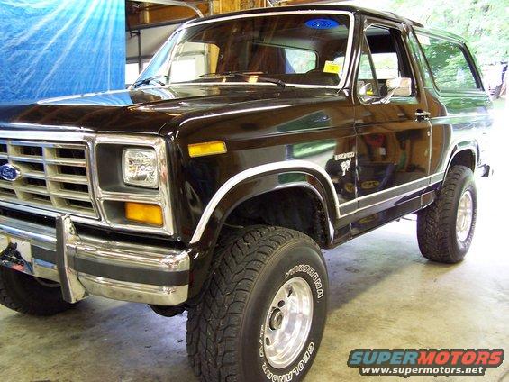 1983 Ford Bronco with chrome grille and trim, parked indoors