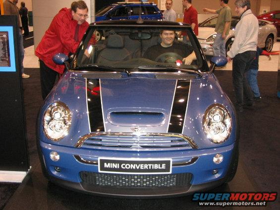 Blue Mini Convertible with black racing stripes on hood, front view
