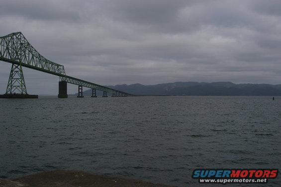 Astoria-Megler Bridge spans Columbia River under cloudy sky