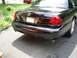 2003 Mercury Marauder - Rear view of a black 2003 Mercury Marauder, showing the distinctive Marauder badging on the bumper.
