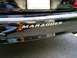 2003 Mercury Marauder - Rear view of a black 2003 Mercury Marauder, showing the MARAUDER badging on the bumper.