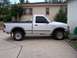 1994 Ford Ranger - This pickup truck is parked in a residential driveway next to a house.