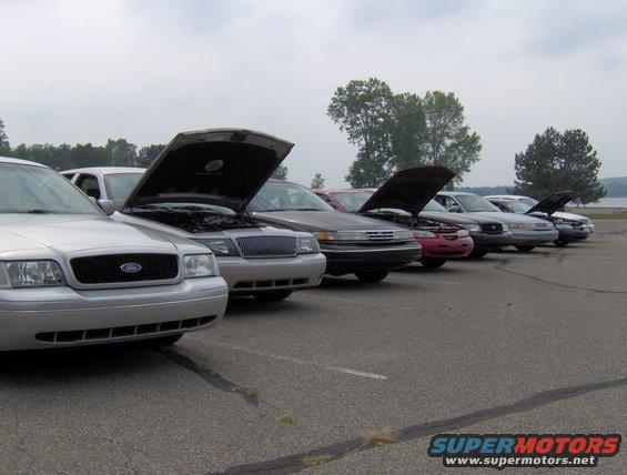 Silver 2002 Ford Crown Victoria front view with hoods open