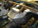 1997 Ford Ranger - The interior of a vehicle shows a custom roll cage and a large metal box installed.