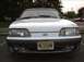 1989 Ford Mustang - Front view of a white 1989 Ford Mustang, identified by its distinctive body style and grille.
