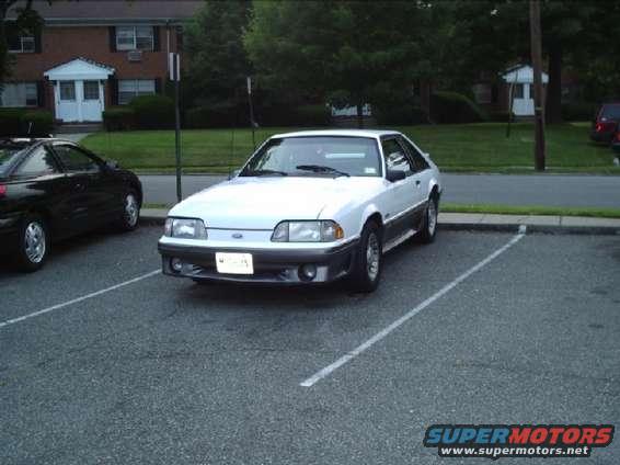 White 1989 Ford Mustang coupe parked in a lot, 3q-front view