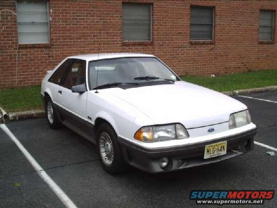 White 1989 Ford Mustang coupe parked in a lot, front 3/4 view