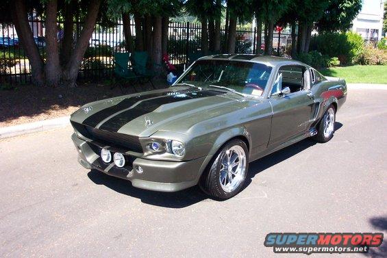 Green 1967 Ford Mustang Shelby GT500 with black stripes and fog lights