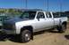 1994 Ford F-150 - This pickup truck features a quad cab and dual rear wheels, indicating a heavy-duty configuration.