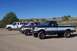 1994 Ford F-150 - Three pickup trucks, including a 1994 Ford F-150, are parked on a dirt lot.