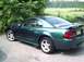 1989 Ford Mustang - This 2001 Ford Mustang GT features a dark green paint job with subtle flame decals along the body.