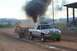 1994 Ford F-150 - A Dodge Ram pickup truck competes in a pull event, generating significant exhaust smoke.