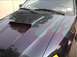 1989 Ford Mustang - This Ford Mustang features a hood scoop and flame decals, indicating a model year around 1999.