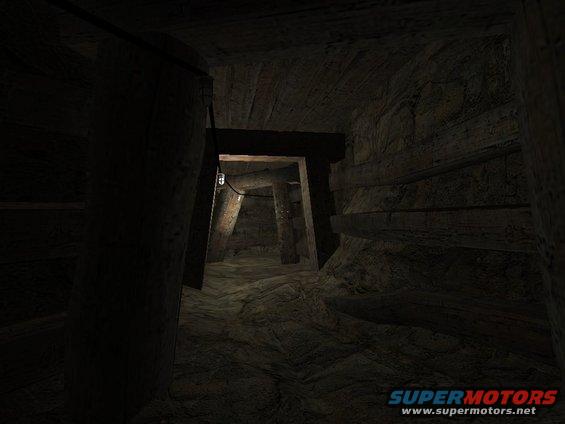 dark mine tunnel with wooden supports and a single light fixture