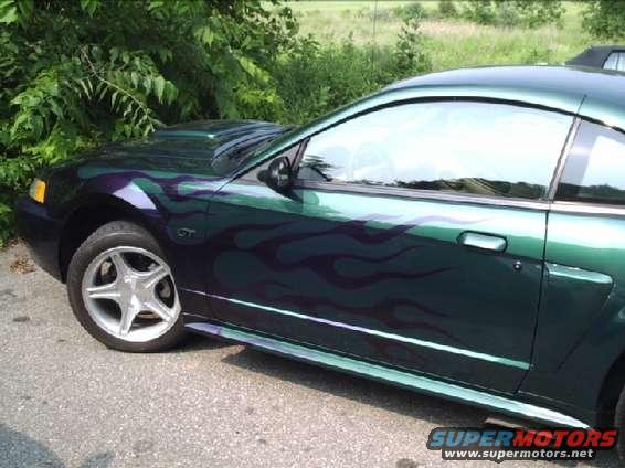 Green 2001 Ford Mustang GT with flame decals, side view