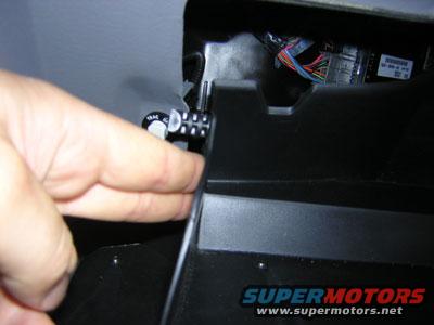 Glovebox is easily removed by pushing the sides of the glovebox for these tabs to clear.  Oh yeah, I had to remove the Traction control button and connector also.