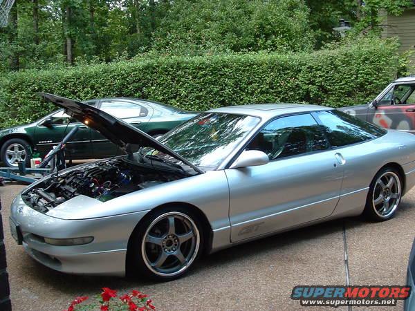 Silver 1993 Ford Probe GT with hood open, parked in driveway