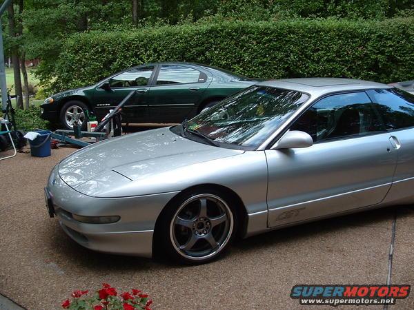 Silver 1993 Ford Probe GT parked next to a green sedan
