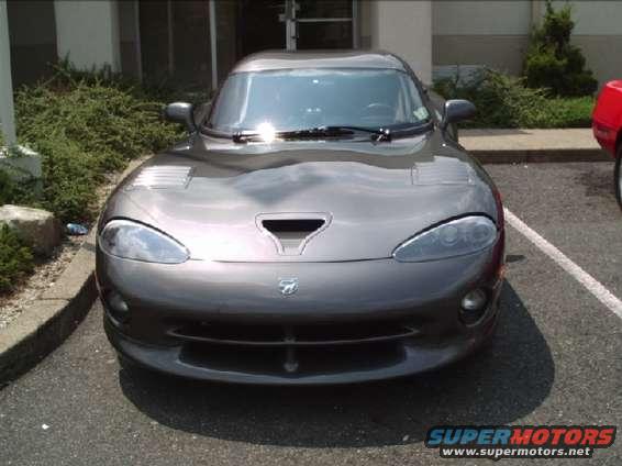 Gray Dodge Viper front view, parked next to a red car