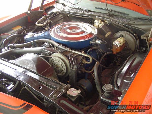 Engine bay with V8 engine, air cleaner, and brake fluid reservoir
