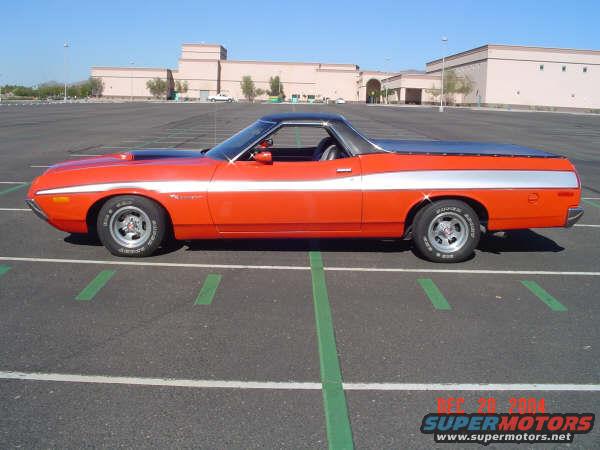Orange and silver 1973 Ford Ranchero side view. Black vinyl top