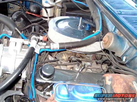 engine3.jpg driver's-side view of engine. The carb is set way back under the cowl, angled back, and 2" off-center