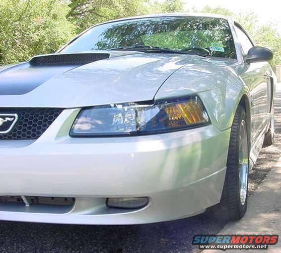 Silver 1999 Ford Mustang front quarter view with hood scoop