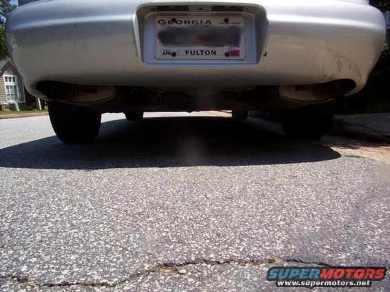dual_exhaust_under.jpg Here's a pic of the dual exhaust, which is also stock.  It might be kinda hard to see it but it's there.