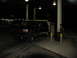 1995 Ford C-350 (Centurion Conversions) - 1995 Ford C-350 (Centurion Conversions) at a gas station at night, with a trailer attached.