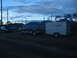 1995 Ford C-350 (Centurion Conversions) - Ford F-Series truck and trailer parked near a field at dusk.