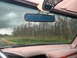 1995 Ford C-350 (Centurion Conversions) - Interior view from the driver's seat shows a cloudy sky and trees through the windshield. A temperature display reads 79 F.