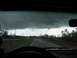 1995 Ford C-350 (Centurion Conversions) - Driving through a storm with heavy clouds overhead and rain on the windshield.